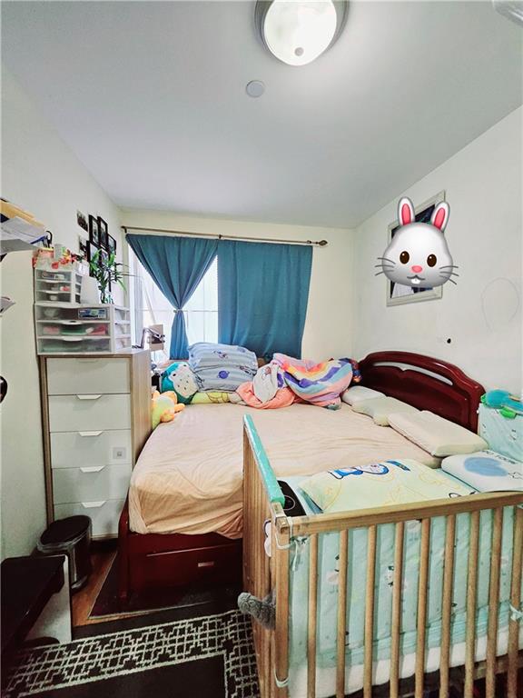 1820 73rd Street, Unit 1A Brooklyn, NY 11204 - Photo 6 of 20 a bedroom with a bed and wooden floor