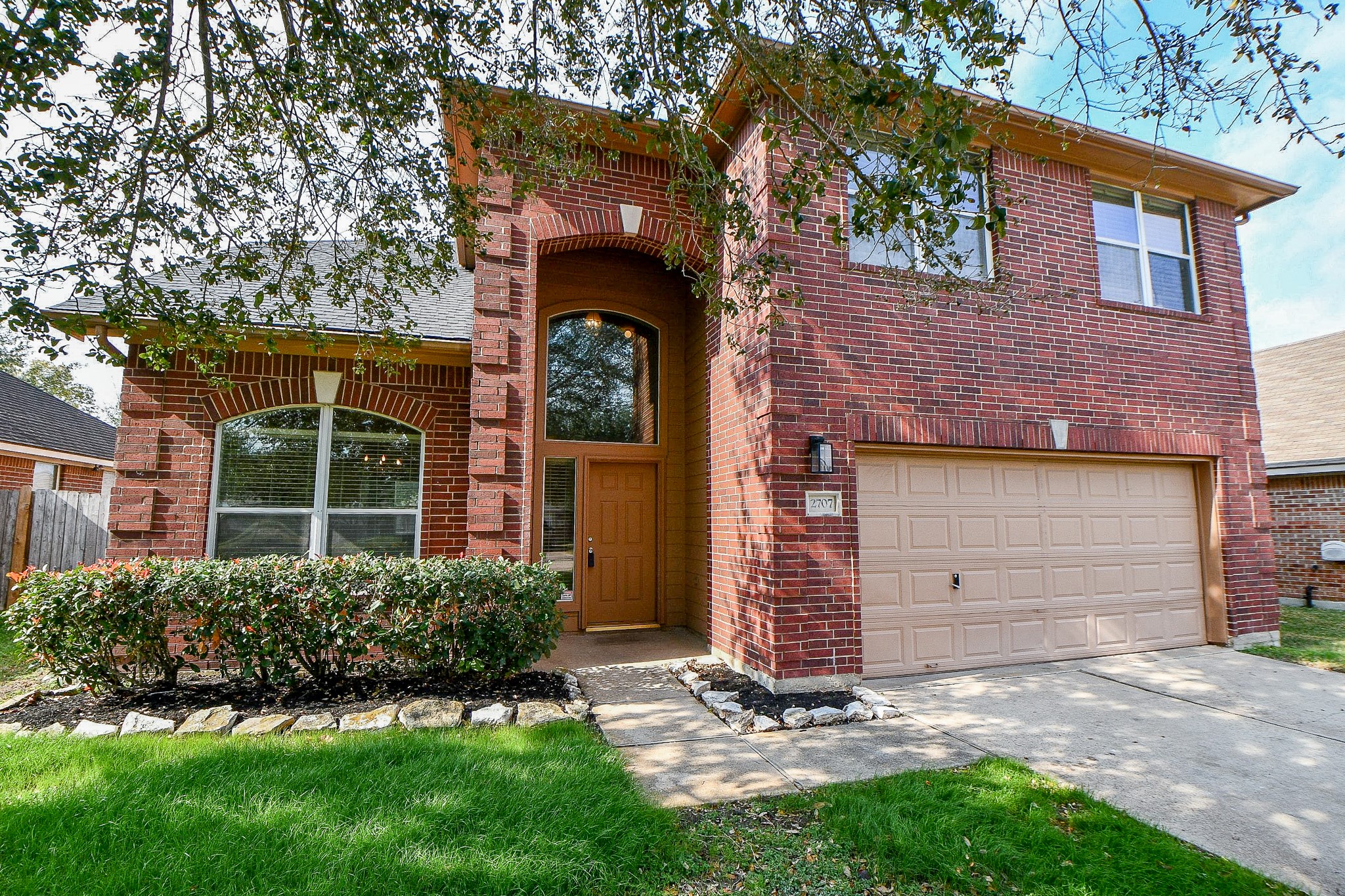 2707 Silk Tree Lane Katy, TX 77449 - Photo 1 of 31 front view of a house with a yard and garage