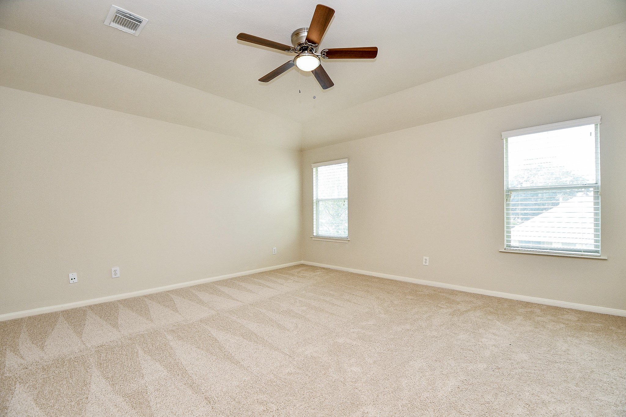 2707 Silk Tree Lane Katy, TX 77449 - Photo 18 of 31 an empty room with a window and a fan