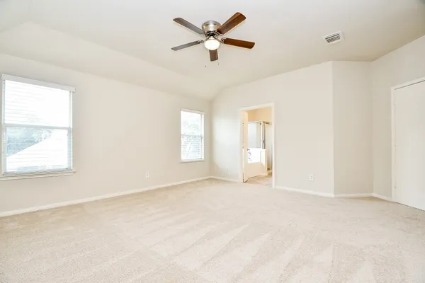 a view of an empty room with a window