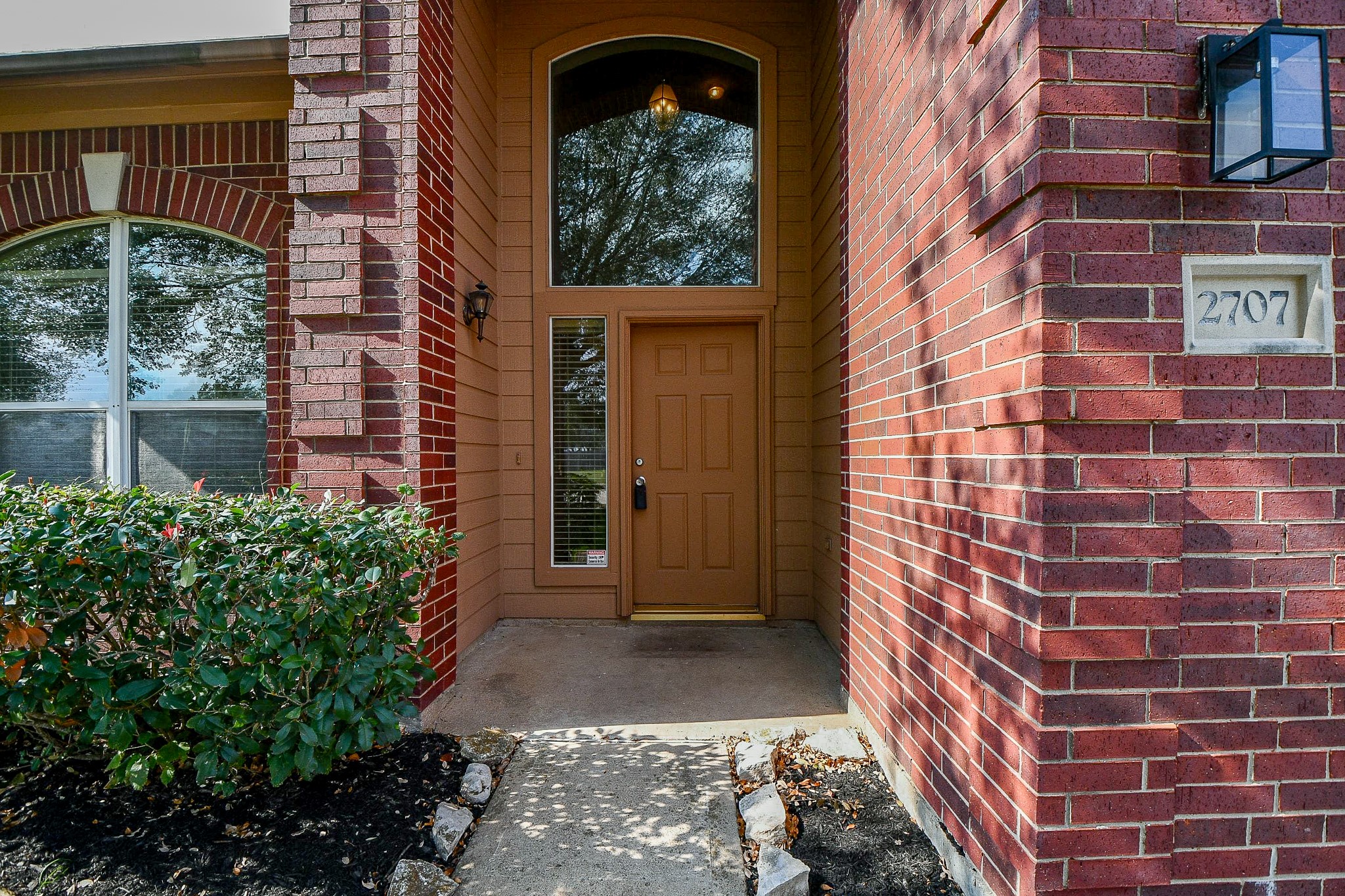 2707 Silk Tree Lane Katy, TX 77449 - Photo 2 of 31 a view of a brick house with a large windows