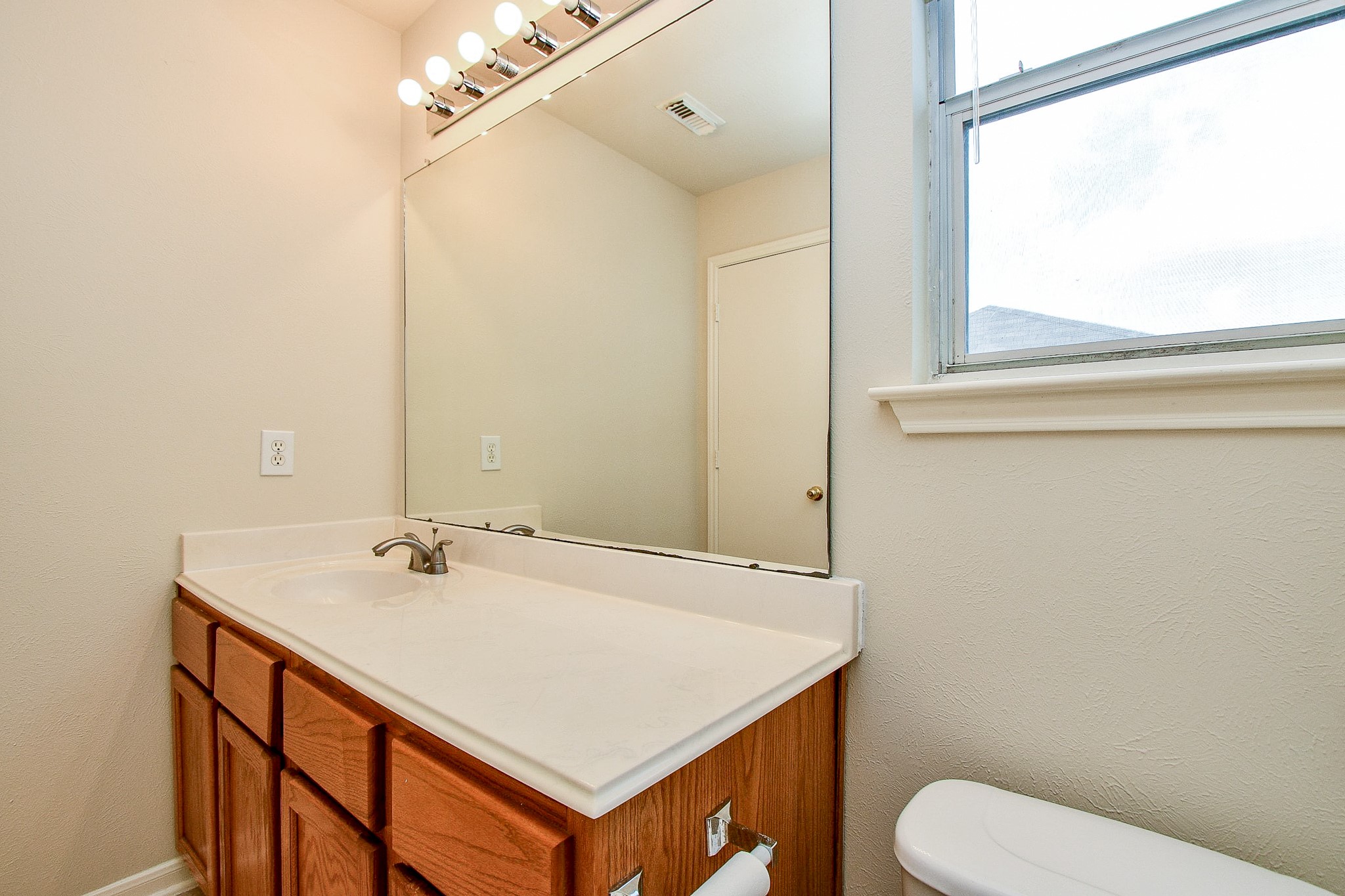 2707 Silk Tree Lane Katy, TX 77449 - Photo 24 of 31 a bathroom with a sink and a toilet