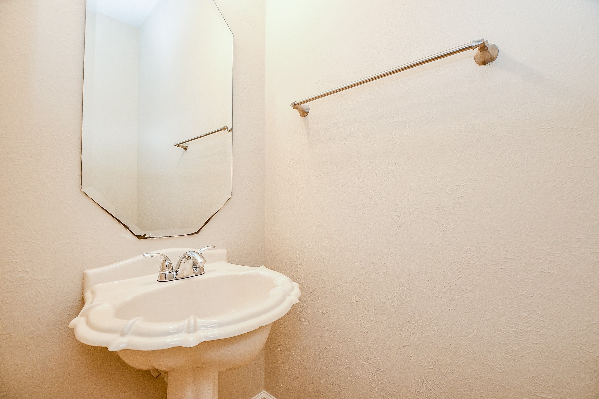 2707 Silk Tree Lane Katy, TX 77449 - Photo 29 of 31 a bathroom with a sink a mirror and shower curtain