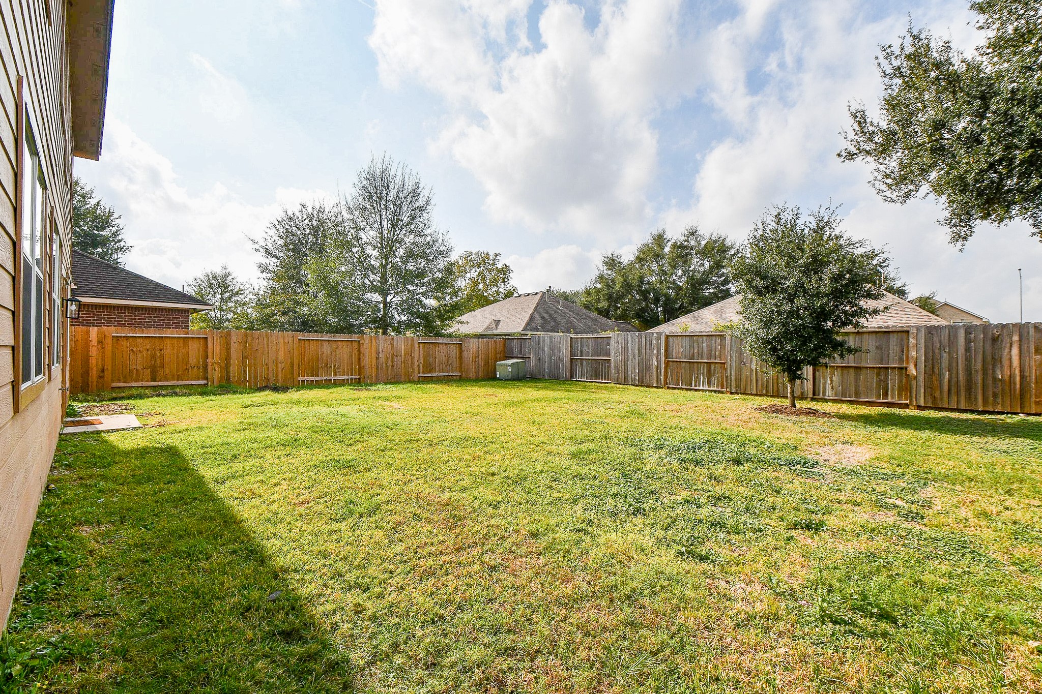 2707 Silk Tree Lane Katy, TX 77449 - Photo 32 of 33 a swimming pool with wooden fence