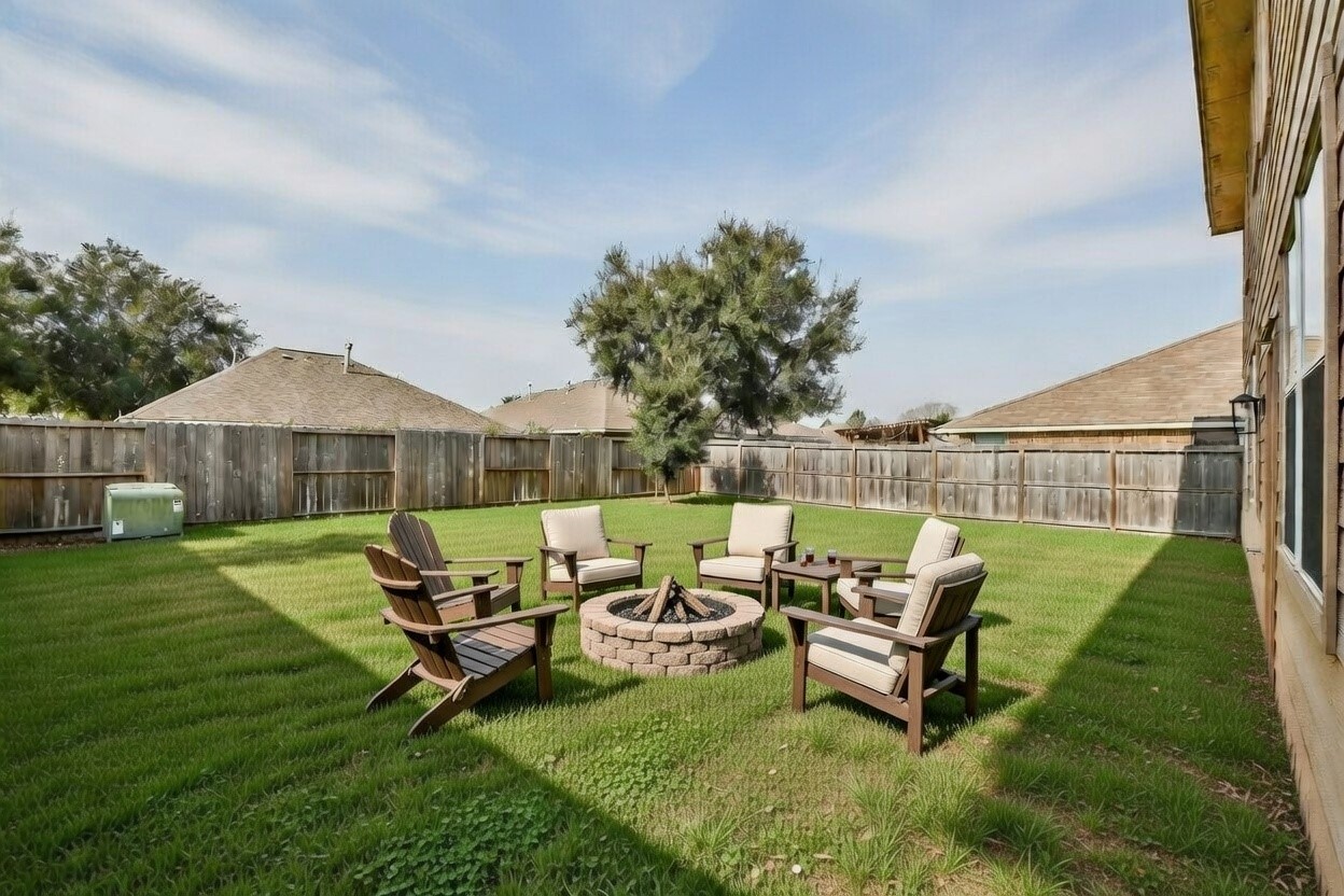 2707 Silk Tree Lane Katy, TX 77449 - Photo 33 of 33 a swimming pool with outdoor seating and green space