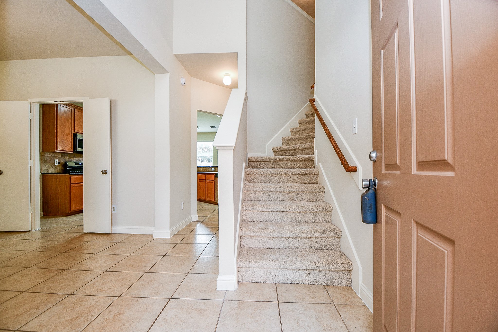 2707 Silk Tree Lane Katy, TX 77449 - Photo 4 of 31 a view of a livingroom with wooden floor and stairs