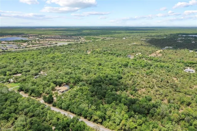 a view of a field with an ocean