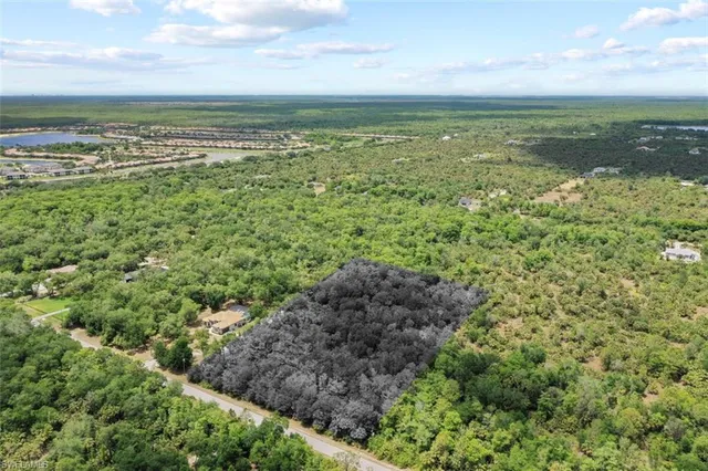 a view of a field with an ocean