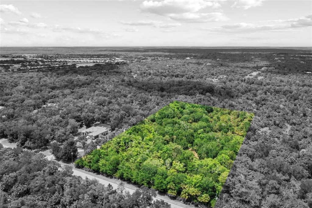 0 33rd Avenue Northwest Naples, FL 34102 - Photo 6 of 34 a view of a green field