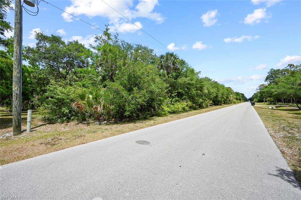 0 33rd Avenue Northwest Naples, FL 34102 - Photo 10 of 34 a view of a road with a yard