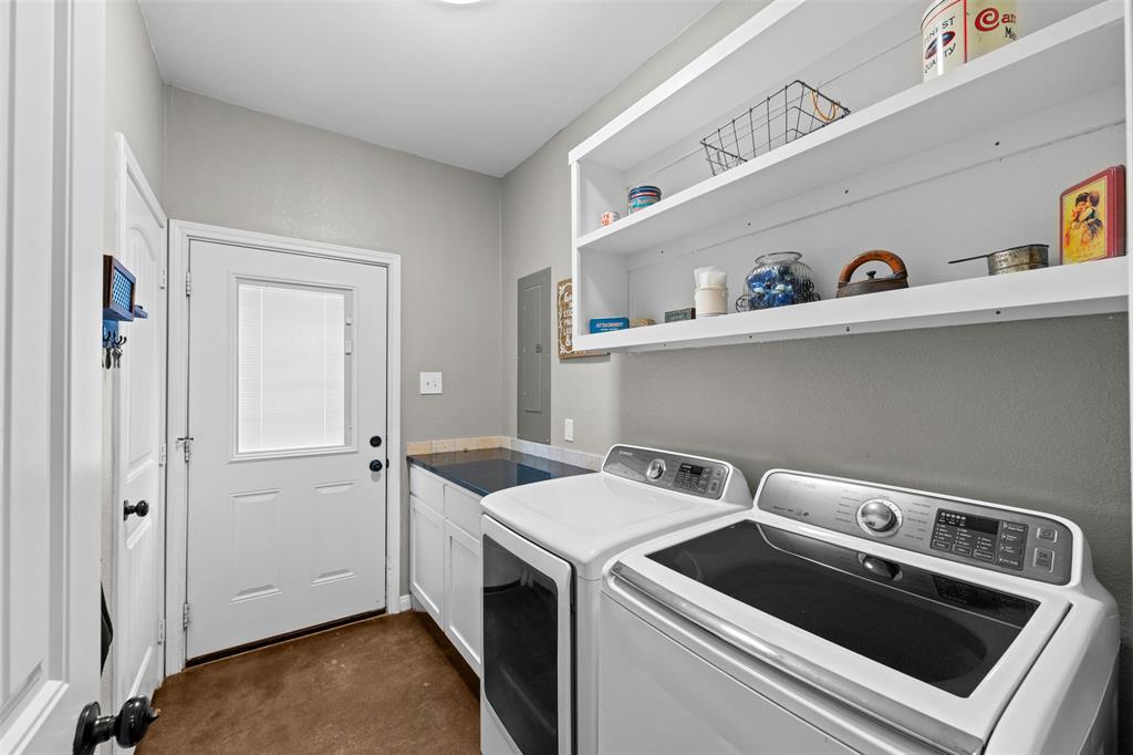 511 East Pecan Tree Road Waxahachie, TX 75165 - Photo 12 of 36 Laundry right off the kitchen- offers plenty of storage.