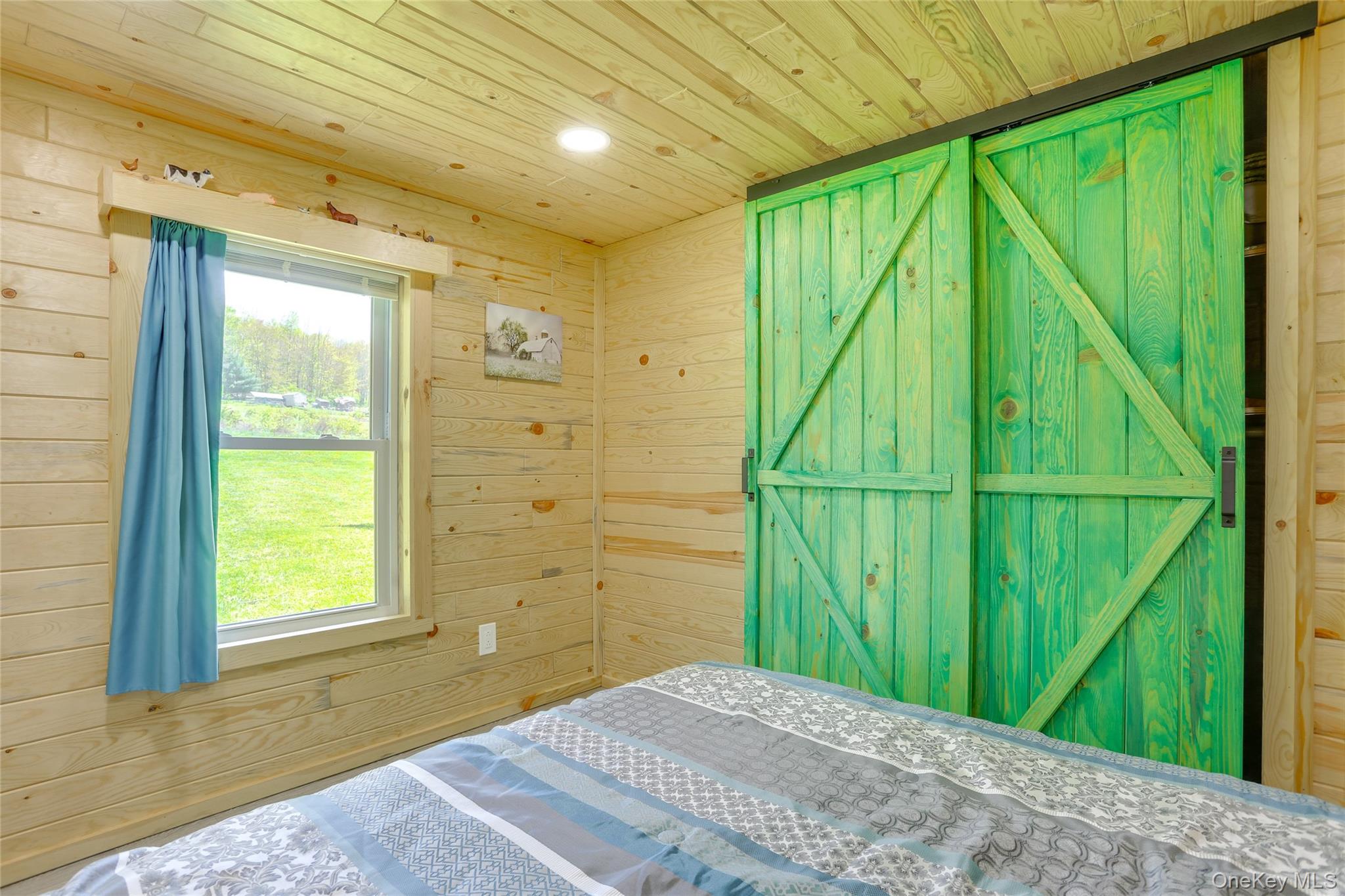 463 County Road 131 Callicoon, NY 12723 - Photo 13 of 29 a bedroom with a bed and a window