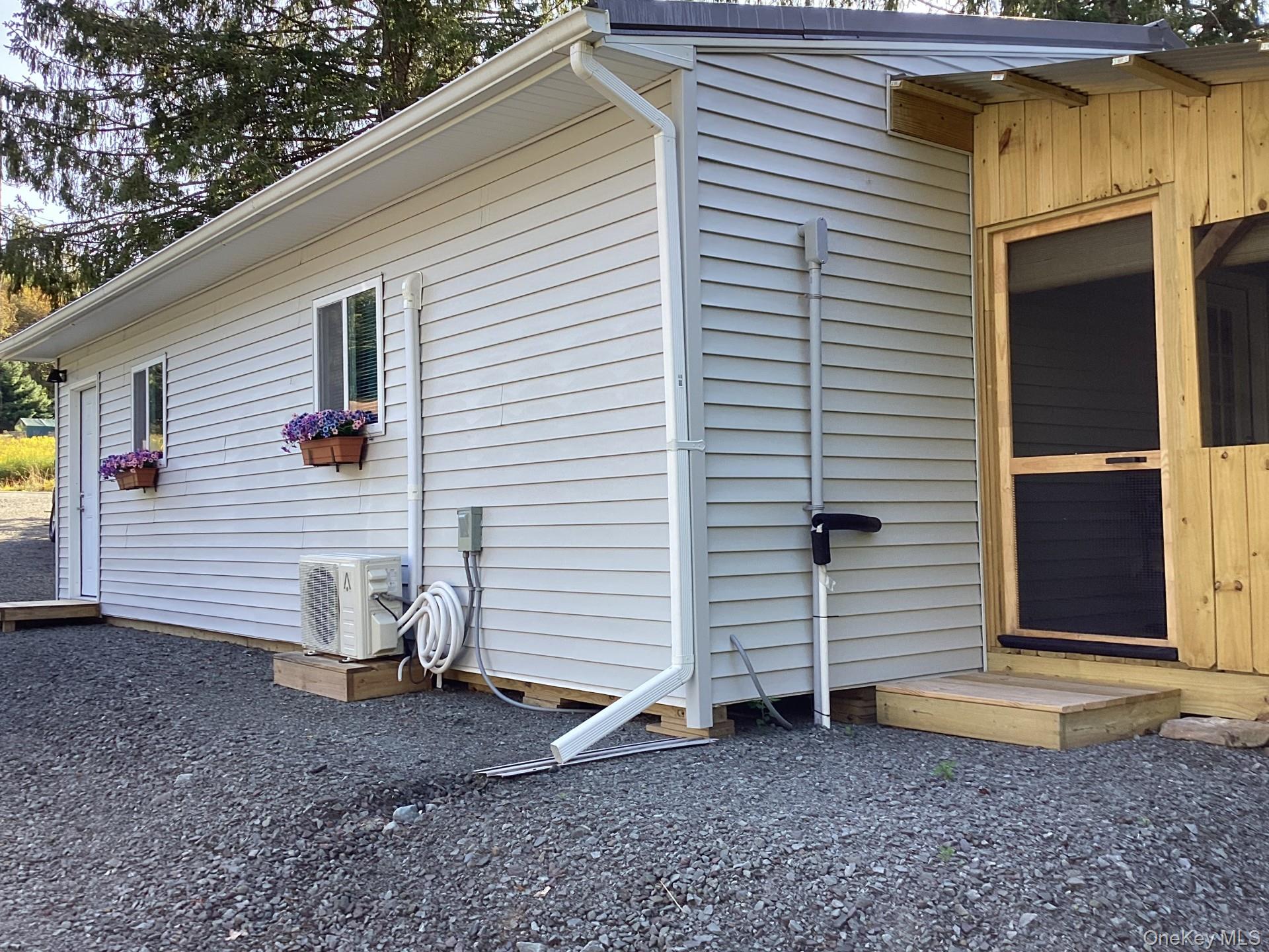 463 County Road 131 Callicoon, NY 12723 - Photo 19 of 29 a view of a house with a yard and garage