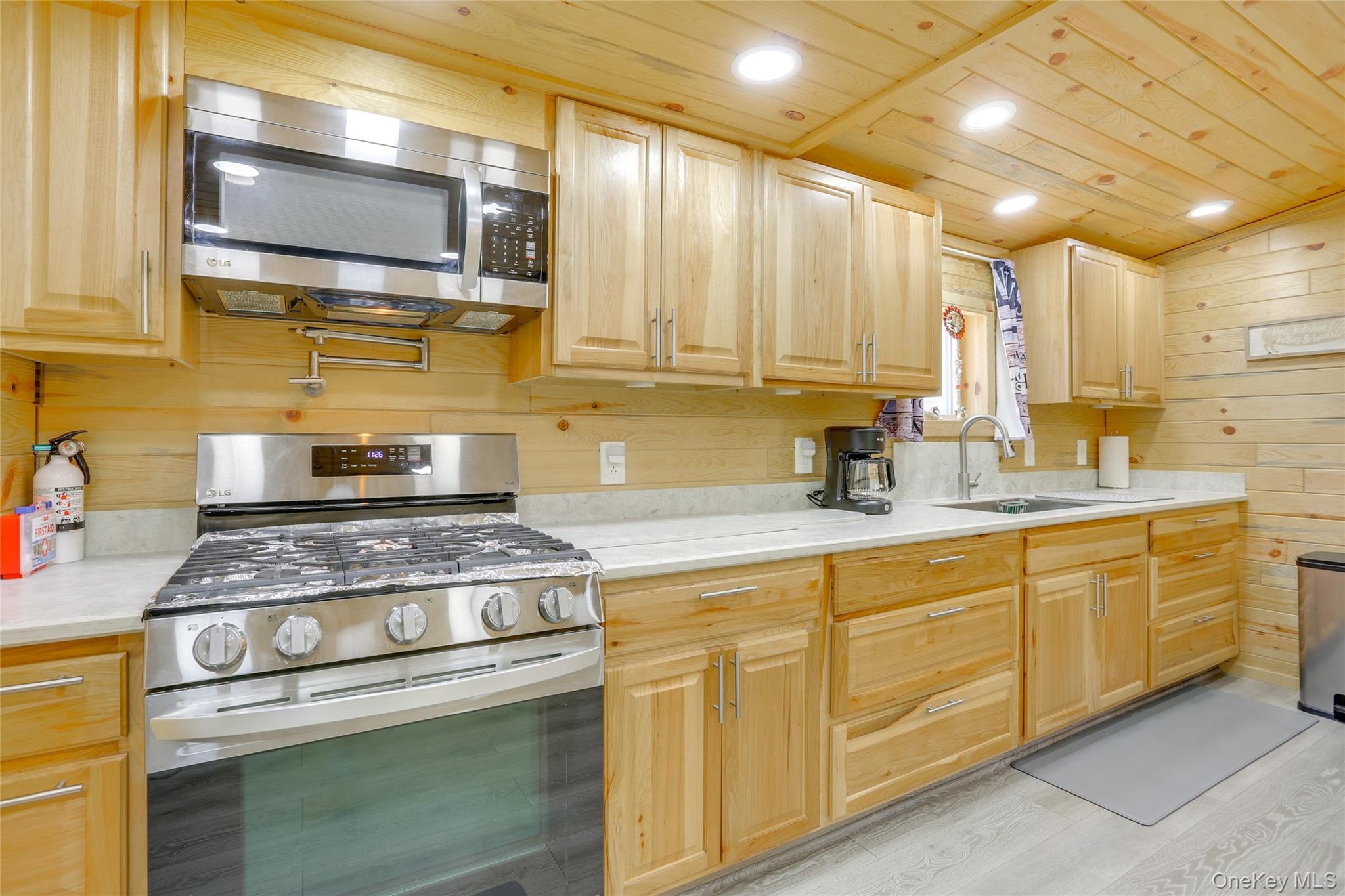 463 County Road 131 Callicoon, NY 12723 - Photo 4 of 29 a kitchen with stainless steel appliances granite countertop a sink a stove and cabinets