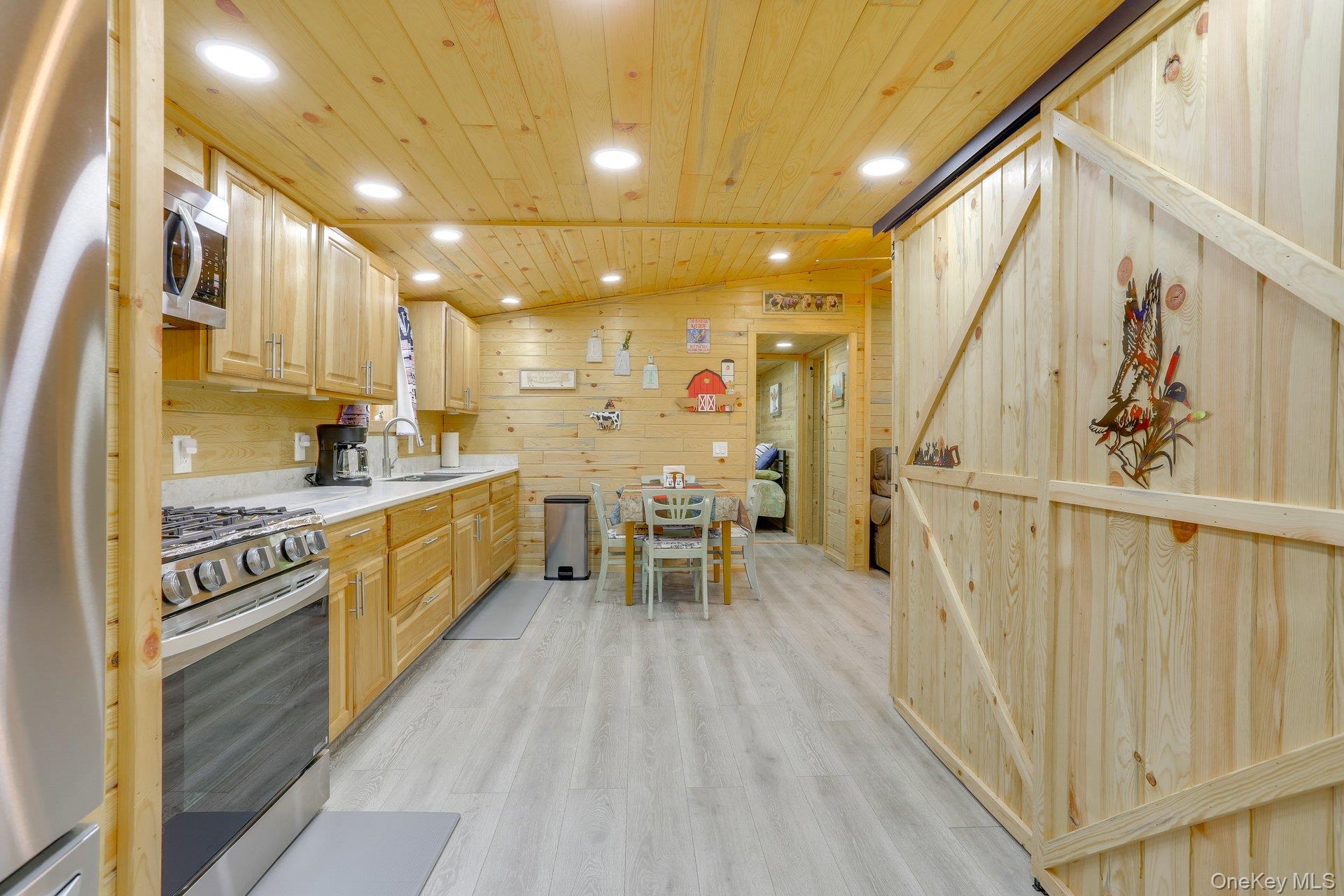 463 County Road 131 Callicoon, NY 12723 - Photo 9 of 29 a kitchen with a sink appliances cabinets and furniture