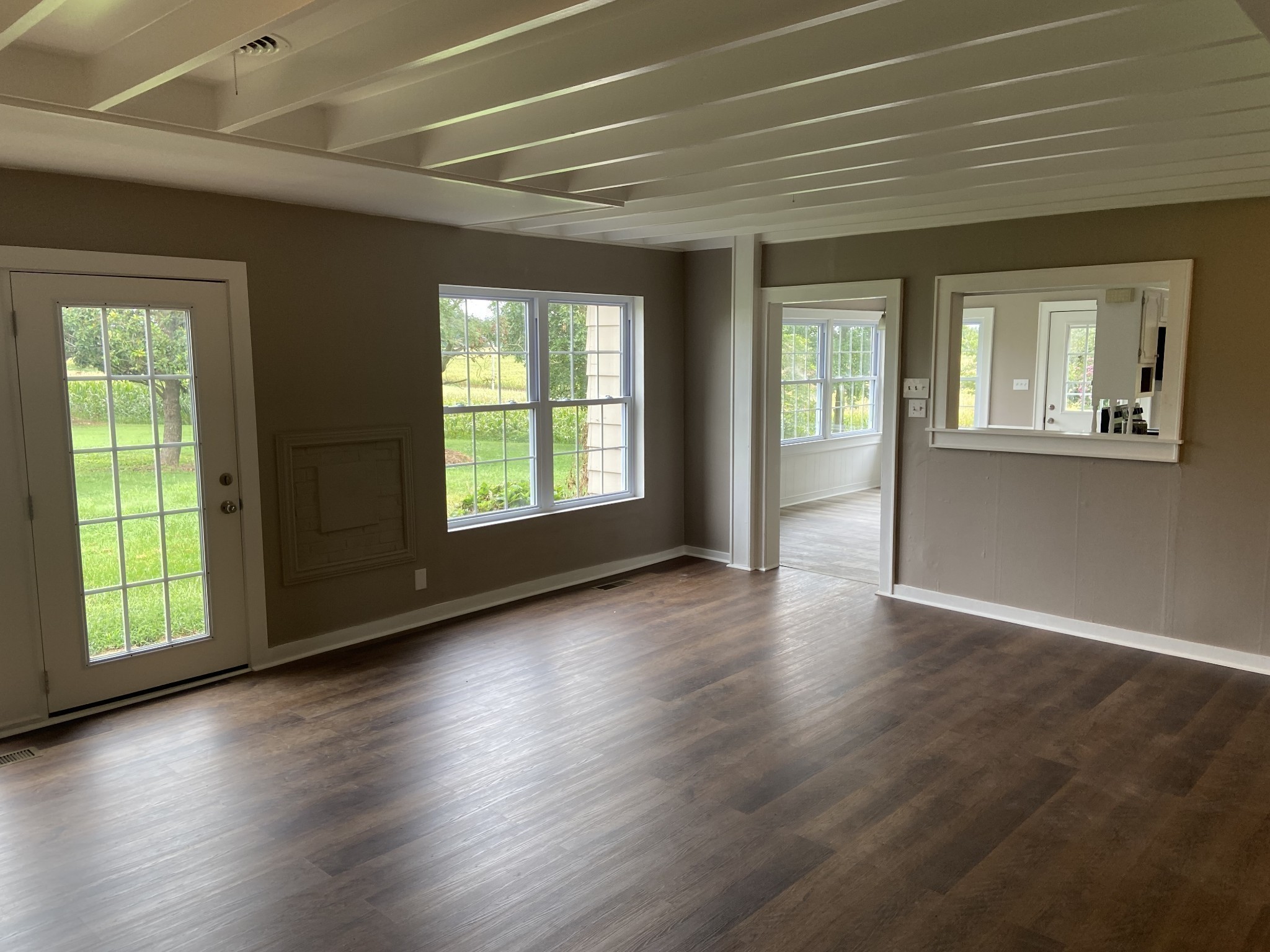 11495 Guthrie Road Guthrie, KY 42234 - Photo 15 of 43 an empty room with wooden floor and windows