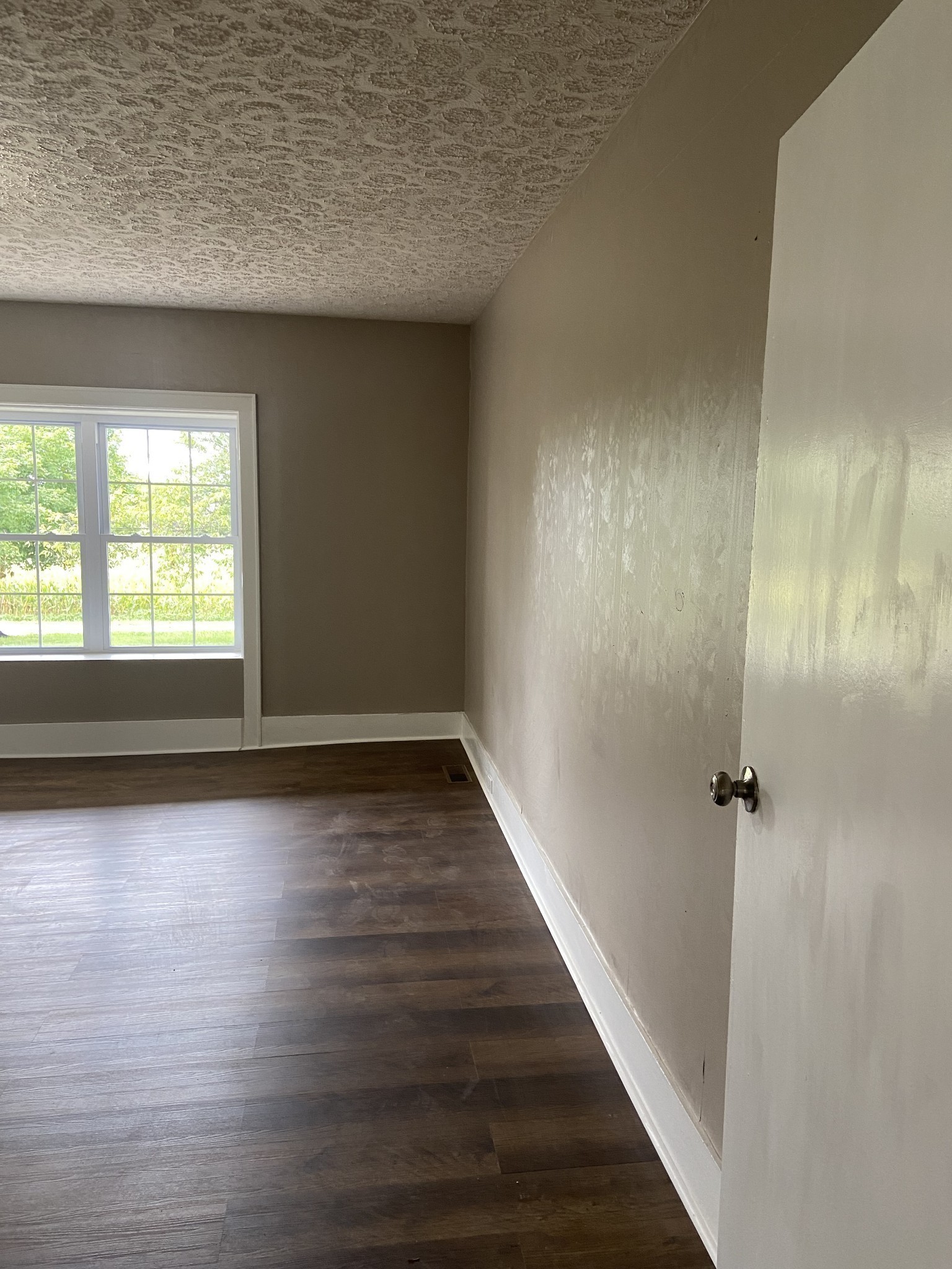 11495 Guthrie Road Guthrie, KY 42234 - Photo 18 of 43 wooden floor in an empty room with a window