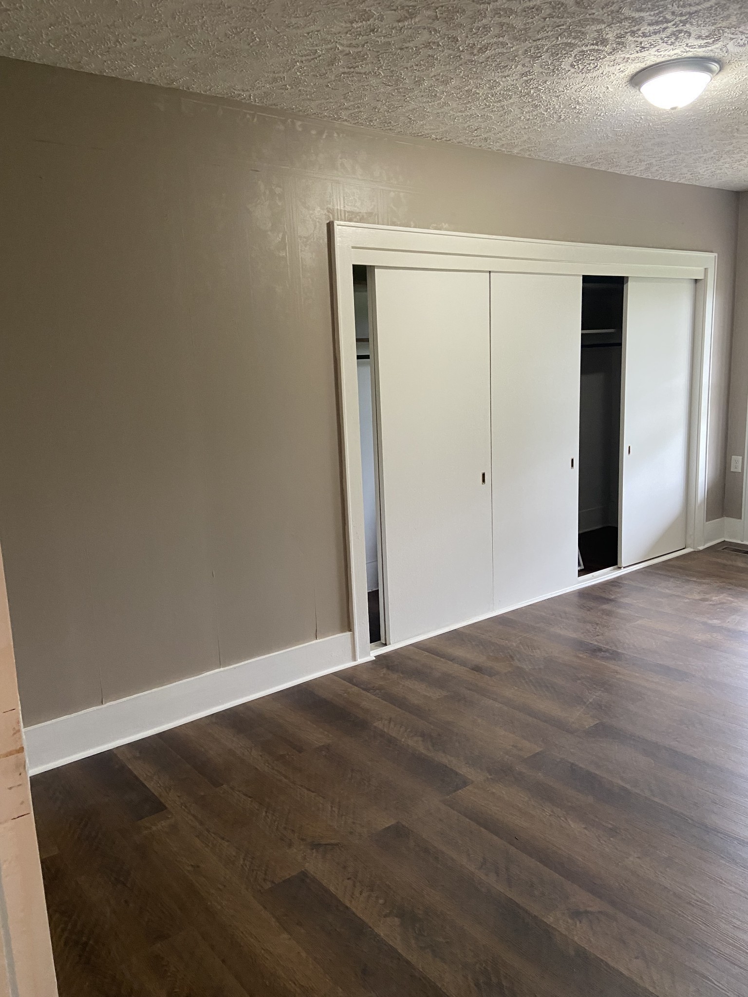 11495 Guthrie Road Guthrie, KY 42234 - Photo 19 of 43 a view of an empty room with wooden floor