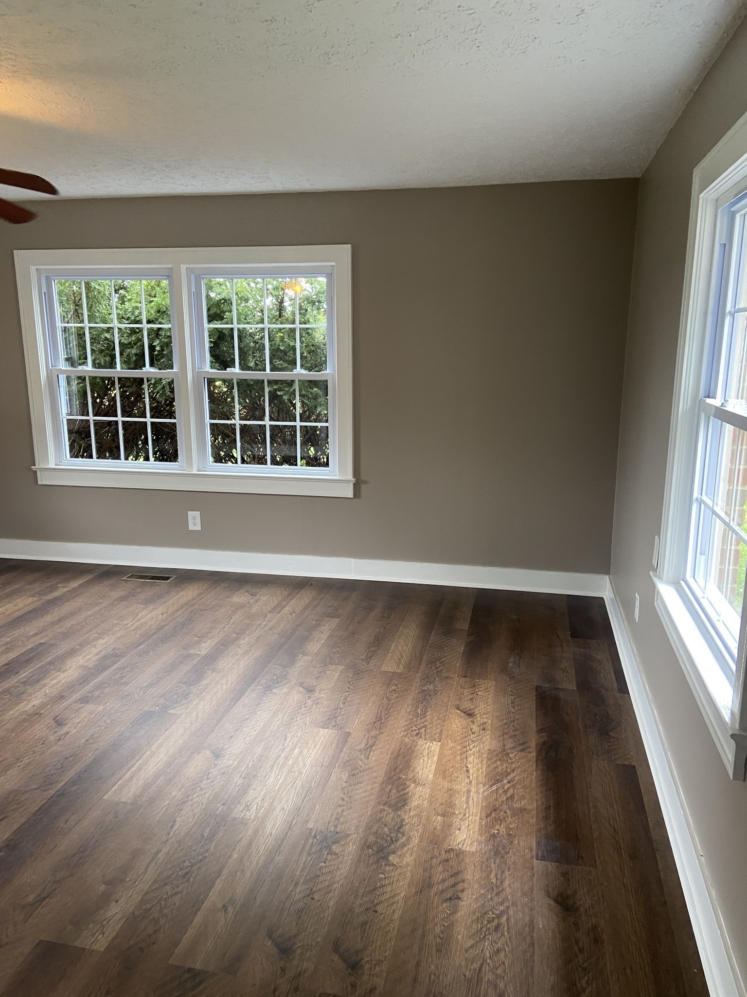 11495 Guthrie Road Guthrie, KY 42234 - Photo 35 of 43 an empty room with wooden floor and windows
