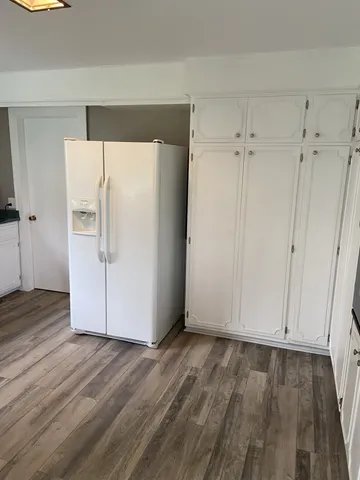 a view of cabinets and wooden floor