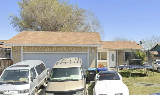 a front view of a house with swimming pool