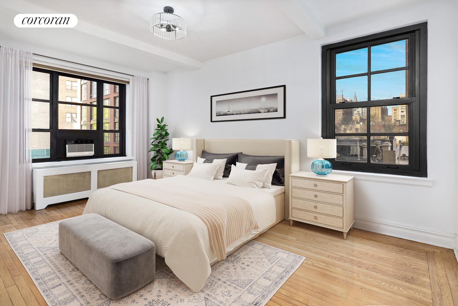 235 East 22nd Street, Unit 6P Manhattan, NY 10010 - Photo 4 of 5 a bedroom with a large bed and a window