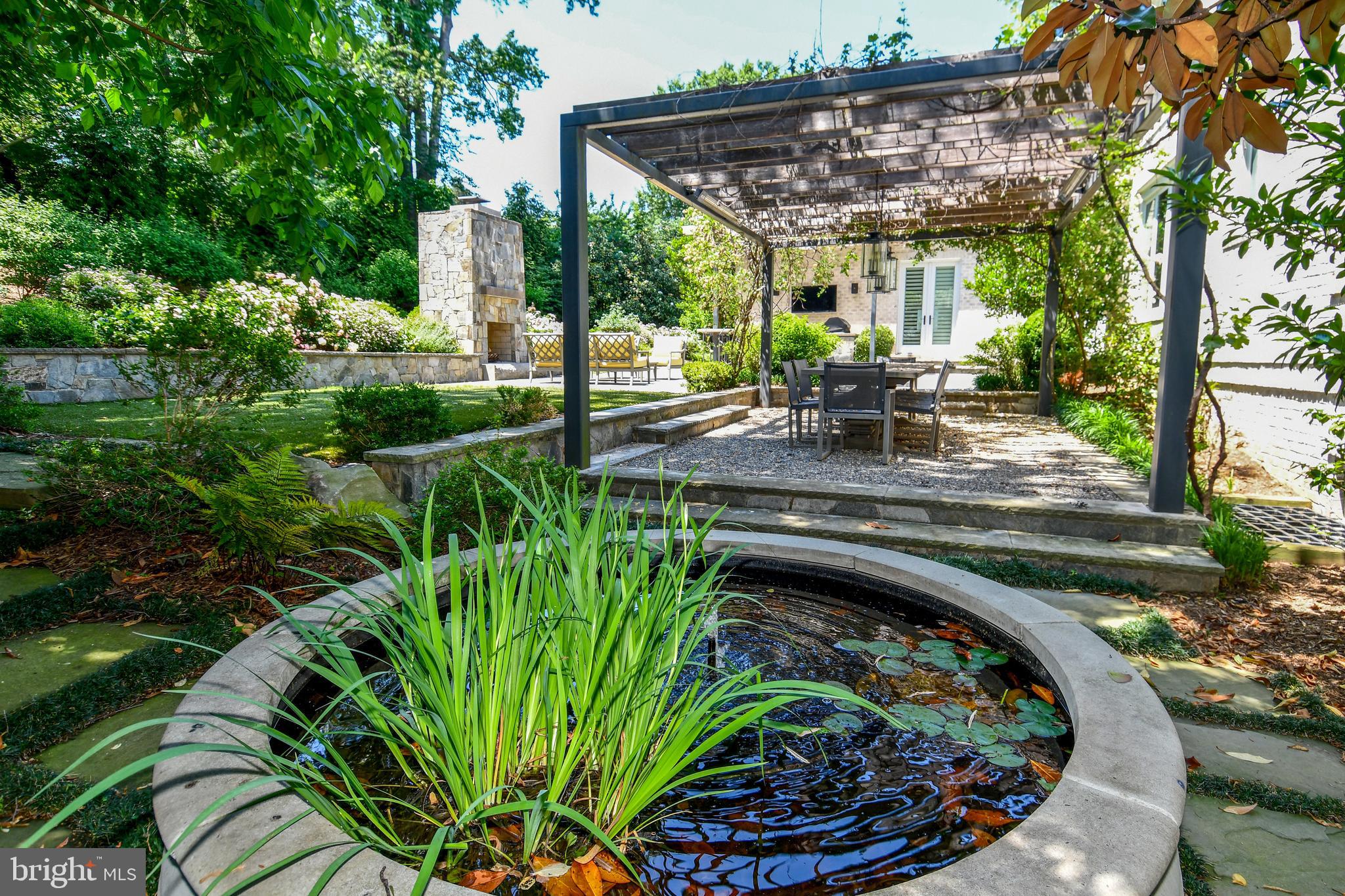 7808 Southdown Road Alexandria, VA 22308 - Photo 25 of 99 a view of a backyard with plants and a patio