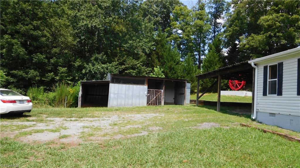 1334 White Rock Road Pinnacle, NC 27043 - Photo 14 of 27 This home a 2 car attached carport. This is one of the storage buildings that easily work as a small barn.