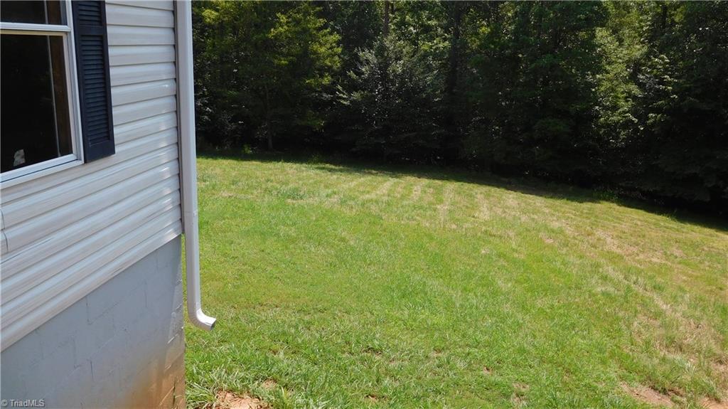 1334 White Rock Road Pinnacle, NC 27043 - Photo 22 of 27 Side view. Also, wooded.