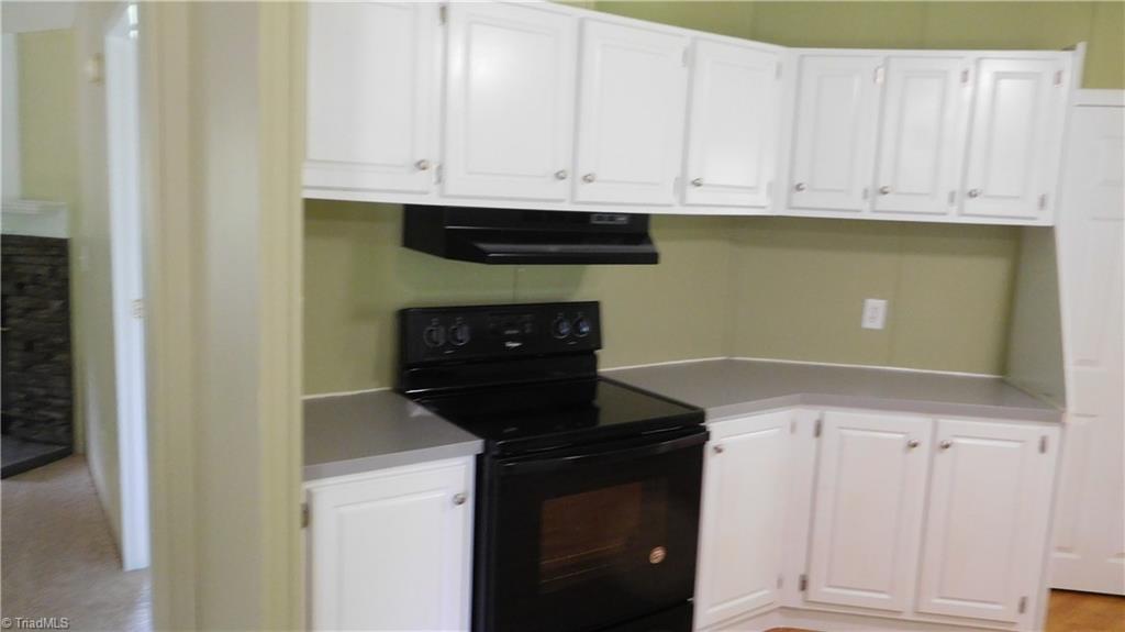 1334 White Rock Road Pinnacle, NC 27043 - Photo 4 of 27 Kitchen off of LR has plenty of cabinets & new appliances.