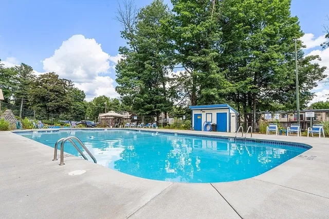 a view of a swimming pool with a patio