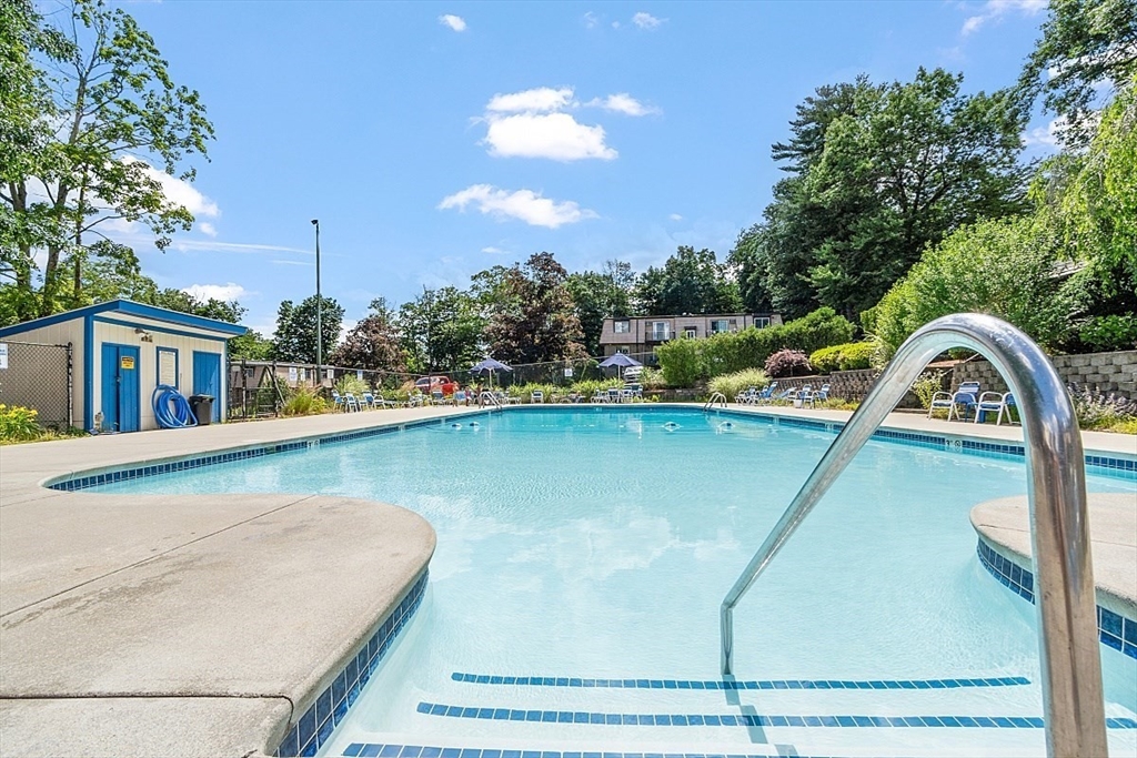 3 Pembroke Drive, Unit 5 Derry, NH 03038 - Photo 12 of 15 a view of a swimming pool with a yard