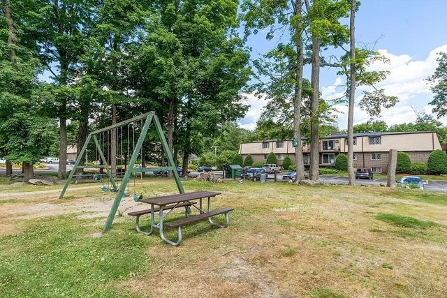a view of a park with swings and slides