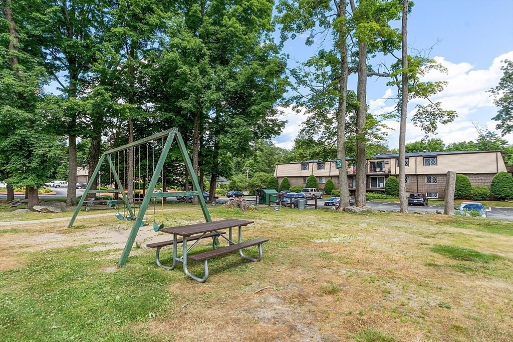 3 Pembroke Drive, Unit 5 Derry, NH 03038 - Photo 14 of 15 a view of a park with swings and slides