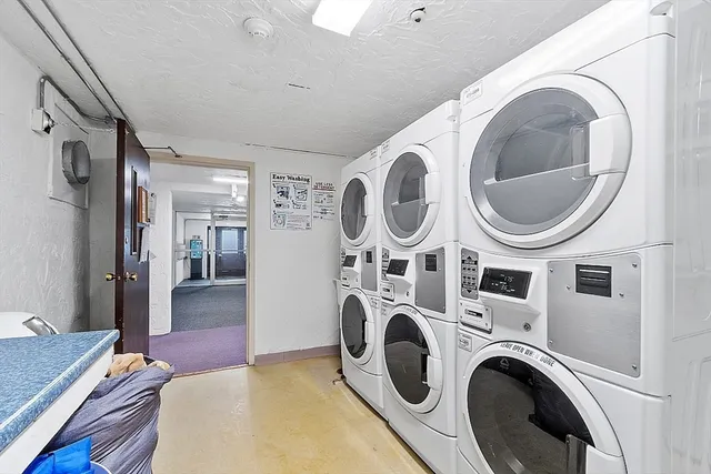 a living room with dryer and washer