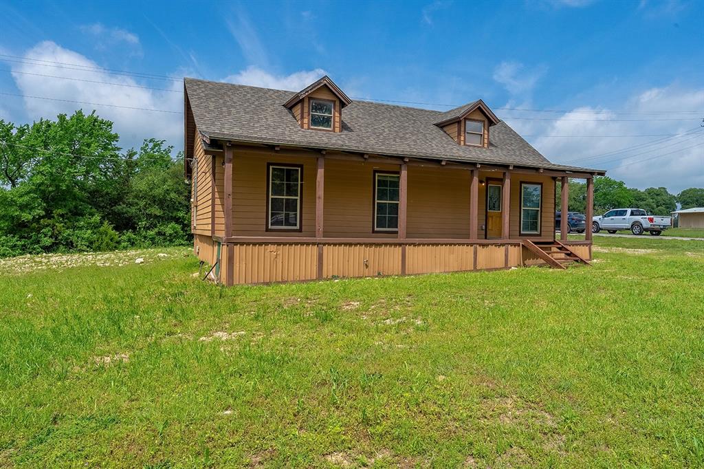 371 Spring Street Forestburg, TX 76239 - Photo 38 of 38 a front view of a house with a yard