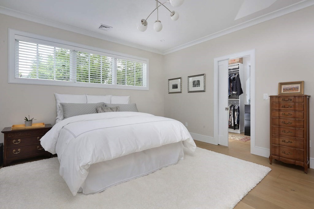 10 Doris Circle Newton, MA 02458 - Photo 11 of 21 a spacious bedroom with a bed and a window