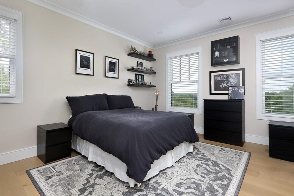 10 Doris Circle Newton, MA 02458 - Photo 14 of 21 a bedroom with a bed and a dresser