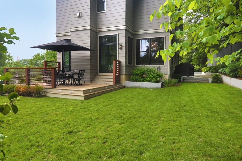 10 Doris Circle Newton, MA 02458 - Photo 18 of 21 a view of a house with a yard and sitting area