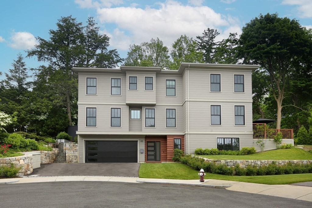 10 Doris Circle Newton, MA 02458 - Photo 2 of 21 a front view of a house with a garden