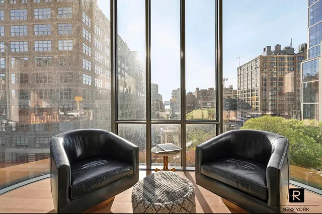 a living room with furniture or couch and a potted plant