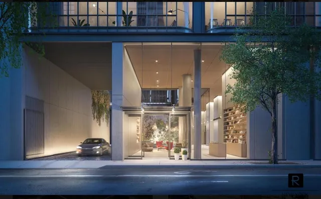 a view of a street with brick walls