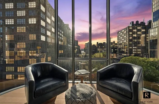 a view of roof deck with couches and wooden floor