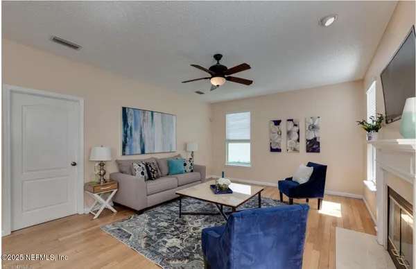 a living room with furniture and a window