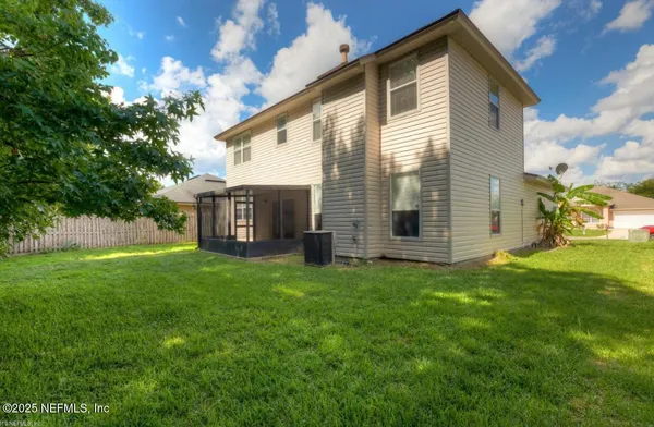 a view of a house with backyard
