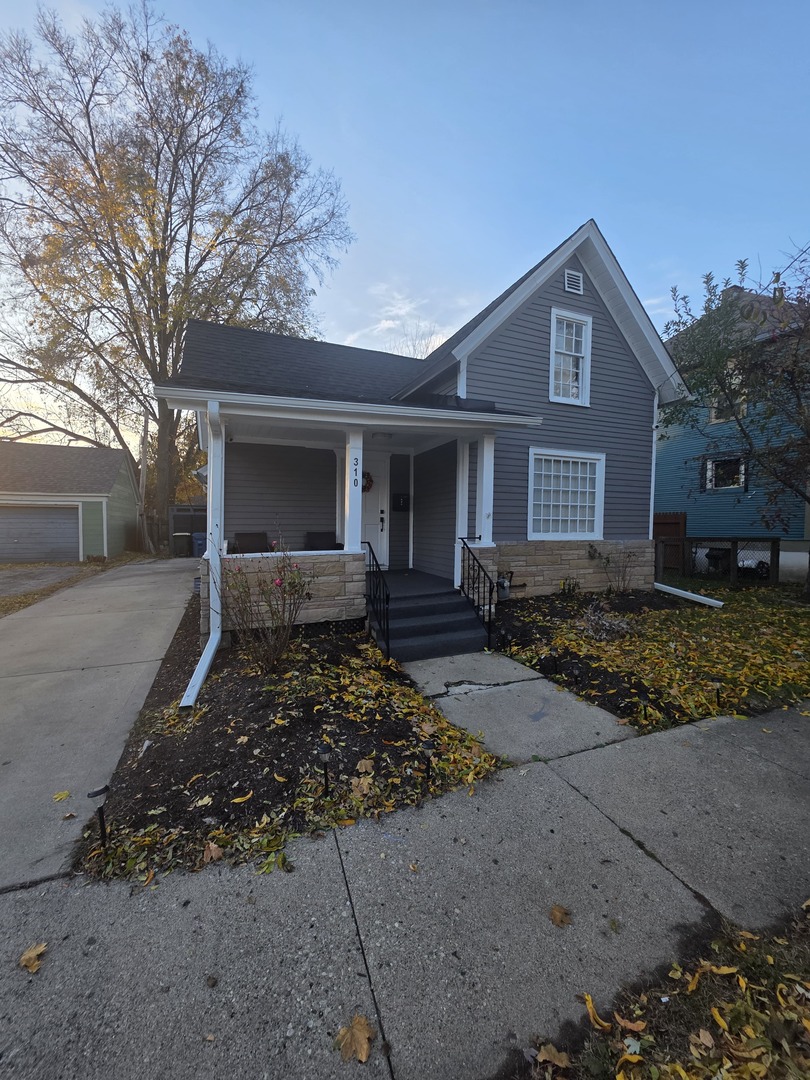 310 North Chestnut Street Aurora, IL 60506 - Photo 1 of 4 a front view of a house with a yard