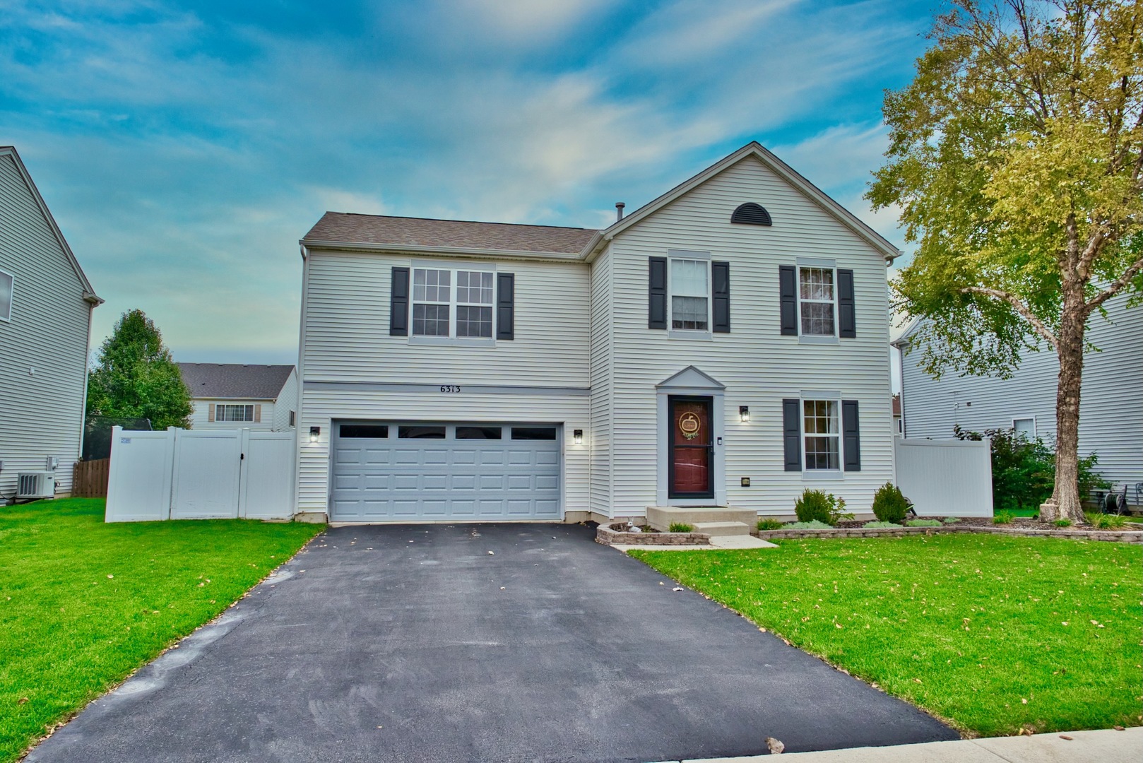 6313 Colton Ridge Court Plainfield, IL 60586 - Photo 1 of 57 a front view of a house with a yard and garage