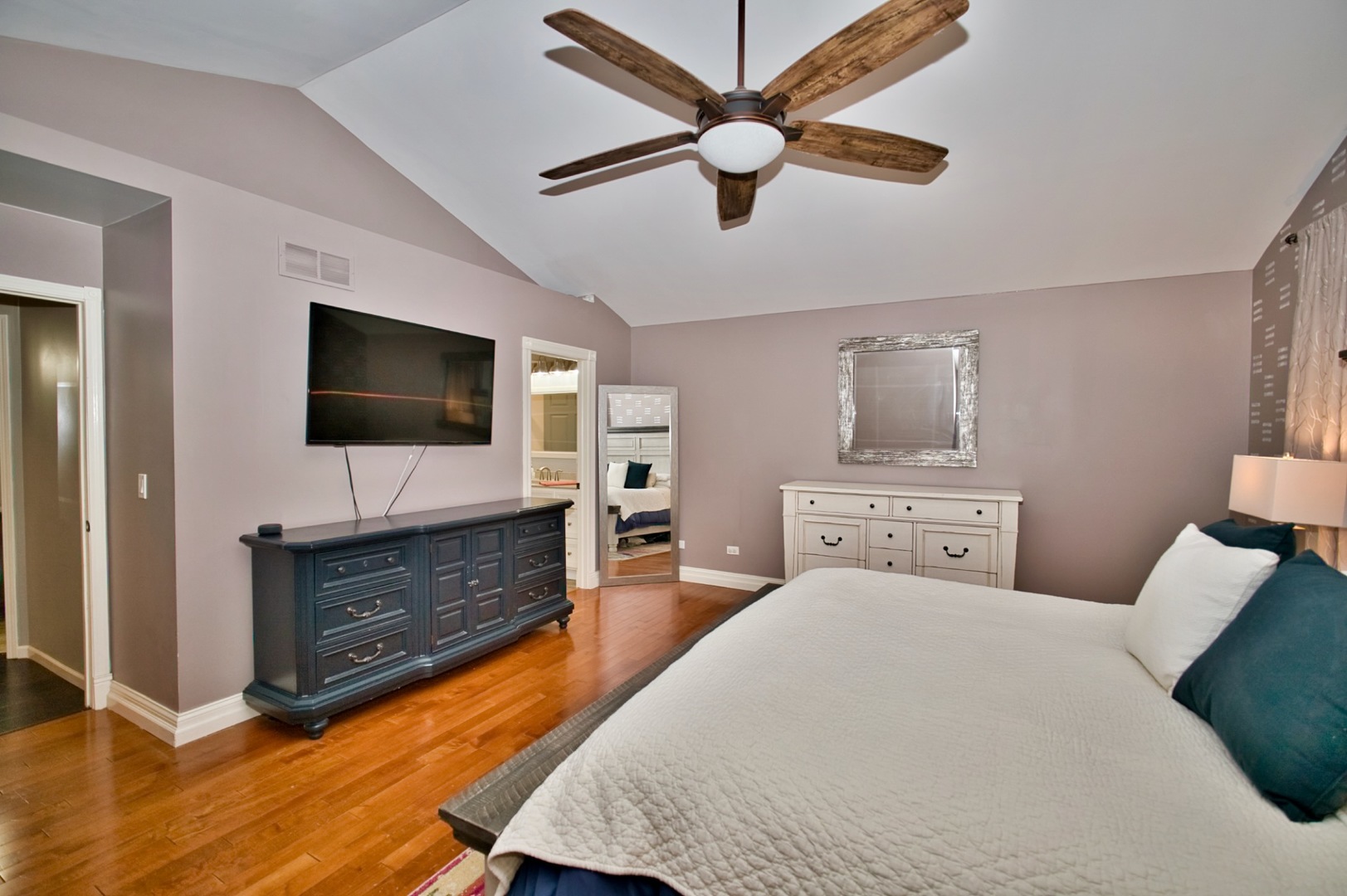 6313 Colton Ridge Court Plainfield, IL 60586 - Photo 33 of 57 a bedroom with a bed and a flat screen tv