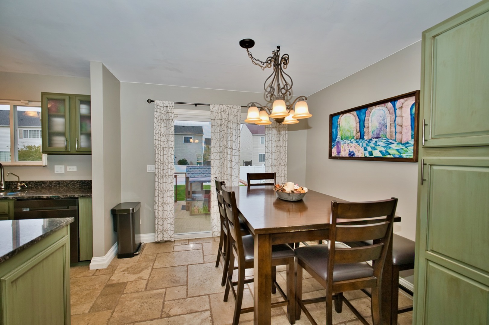 6313 Colton Ridge Court Plainfield, IL 60586 - Photo 10 of 57 a view of a dining room with furniture and chandelier