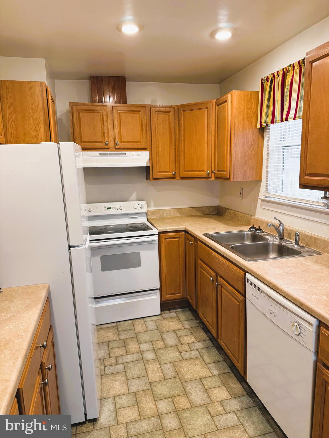 18 Cornell Avenue Bridgeton, NJ 08302 - Photo 6 of 20 a kitchen with a sink cabinets and window